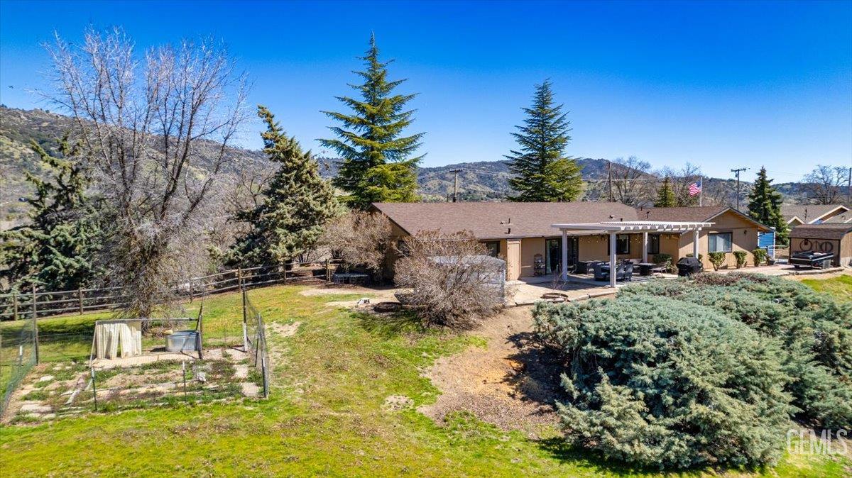 Undisclosed Address Tehachapi, CA 93561 - Photo 66 of 75 a view of a house with swimming pool and yard