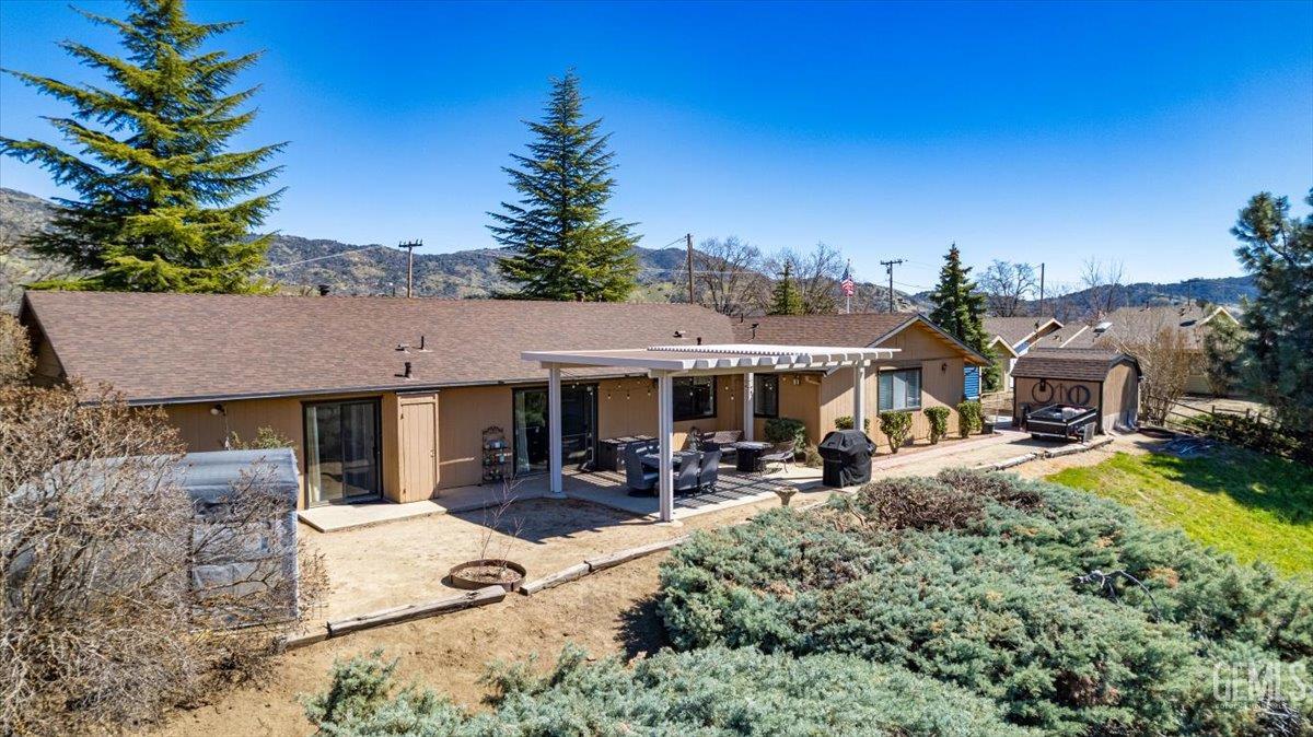 Undisclosed Address Tehachapi, CA 93561 - Photo 67 of 75 aerial view of a house with sitting area and garden