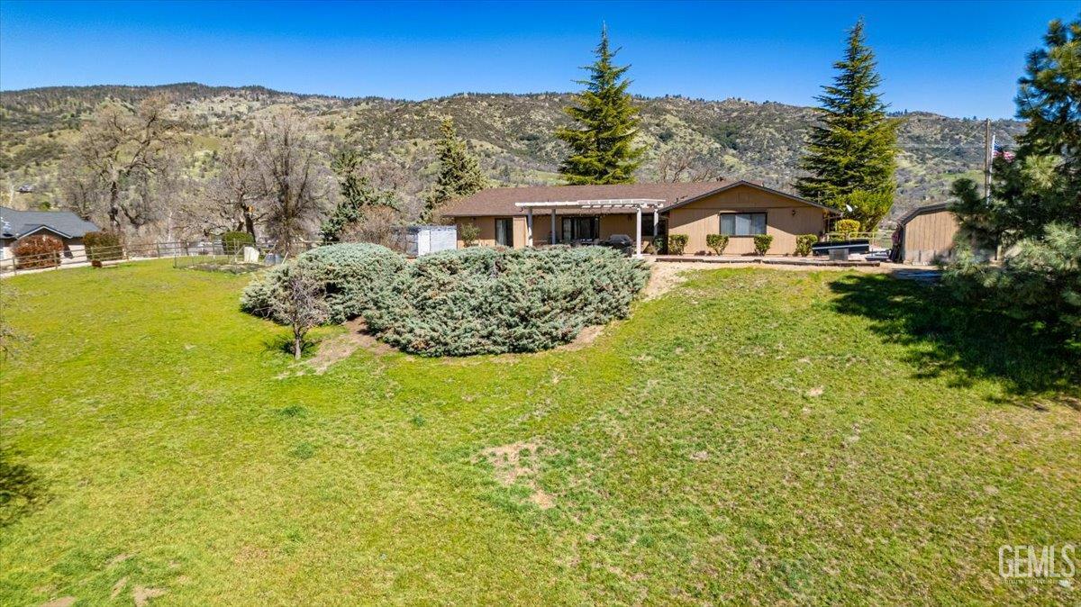 Undisclosed Address Tehachapi, CA 93561 - Photo 70 of 75 a front view of a house with a yard
