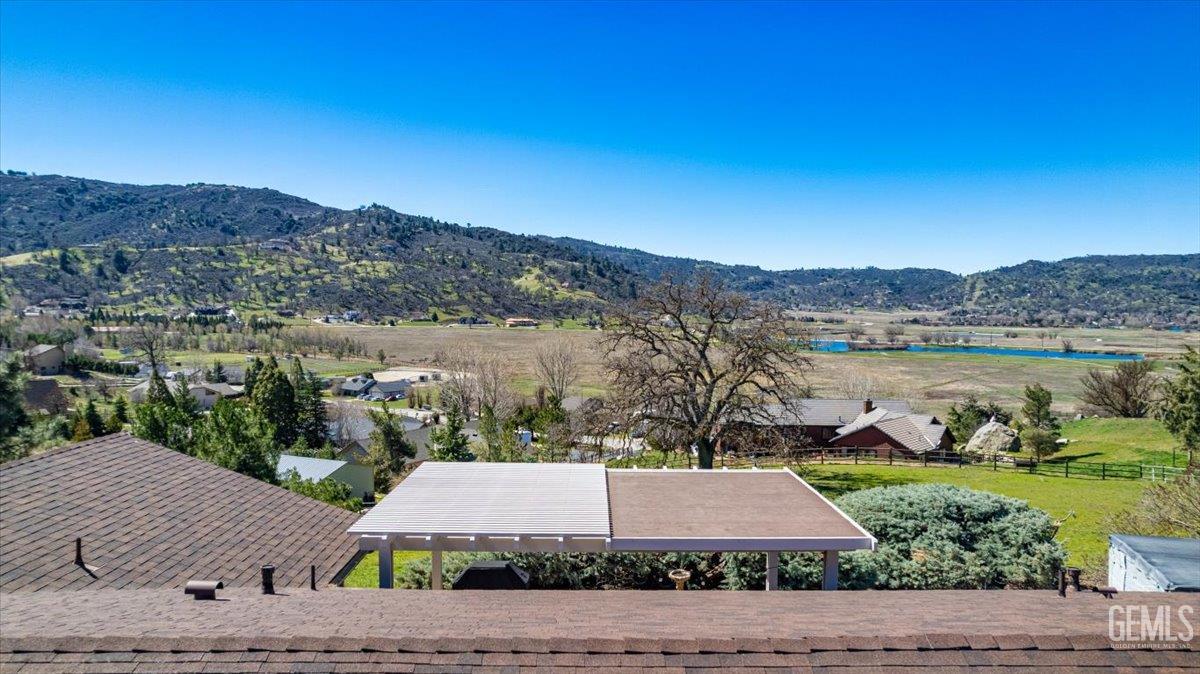 Undisclosed Address Tehachapi, CA 93561 - Photo 73 of 75 an aerial view of a house with a yard and lake view