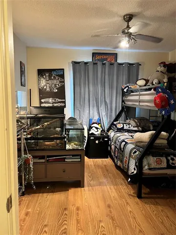 a bed room with a bed and a television