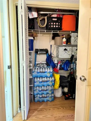 a roof deck with table and chairs potted plants with swimming pool and outdoor seating