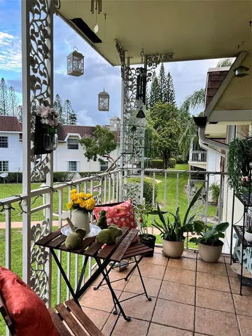 a view of a chairs and table in a patio
