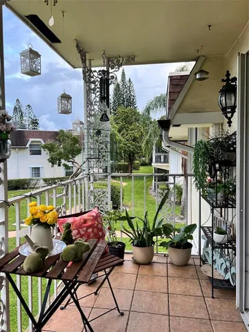 a view of a chairs and table on the terrace