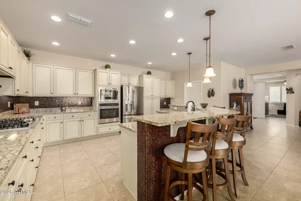 a kitchen with lots of counter top space and appliances