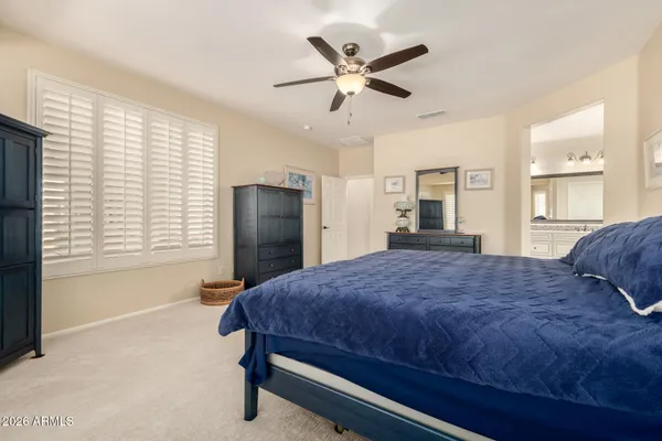 a bathroom with a tub sink a mirror and a shower