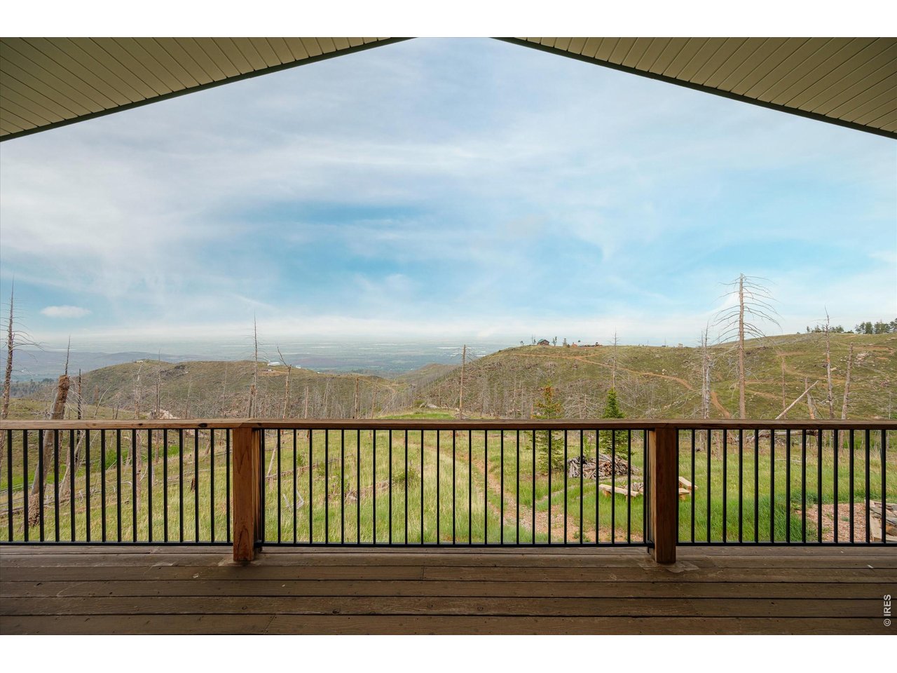 1291 Little Whale Road Bellvue, CO 80512 - Photo 35 of 43 The expansive wrap around deck offers exceptional views of sunrises and plenty of space to sit back and watch the world pass by