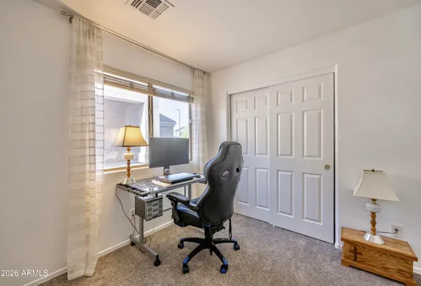 a workspace with furniture and a window
