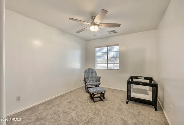 an empty room with closet area