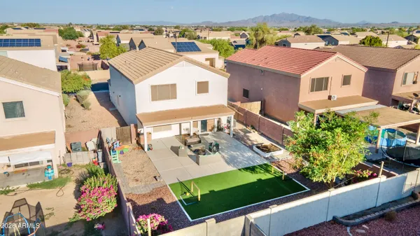 an aerial view of residential houses with outdoor space