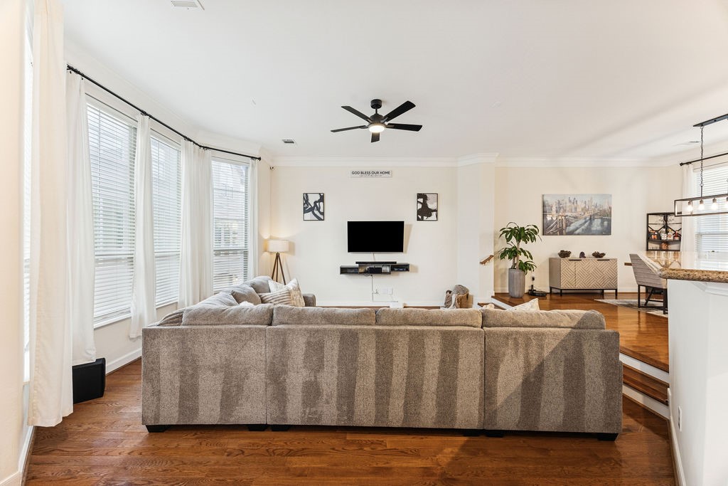 5737 Kansas Street Houston, TX 77007 - Photo 15 of 47 a living room with furniture wooden floor and a flat screen tv