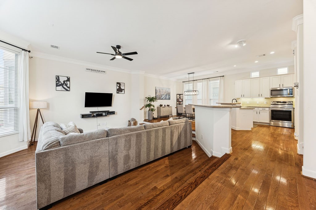 5737 Kansas Street Houston, TX 77007 - Photo 16 of 47 a living room with furniture and a flat screen tv
