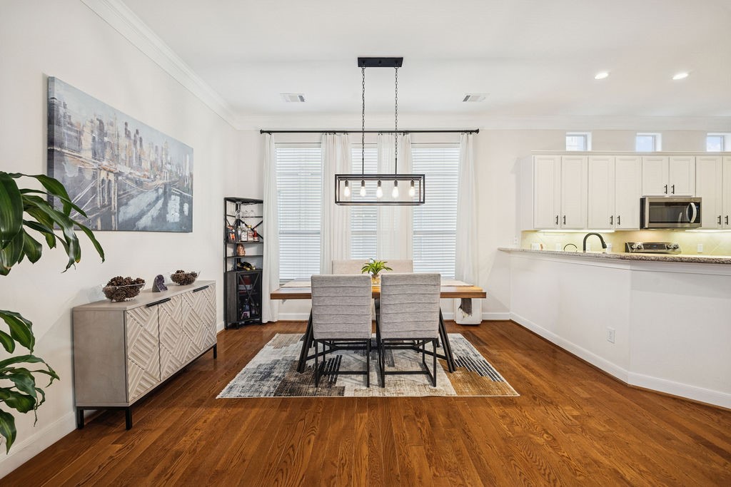 5737 Kansas Street Houston, TX 77007 - Photo 17 of 47 a living room with furniture and a wooden floor