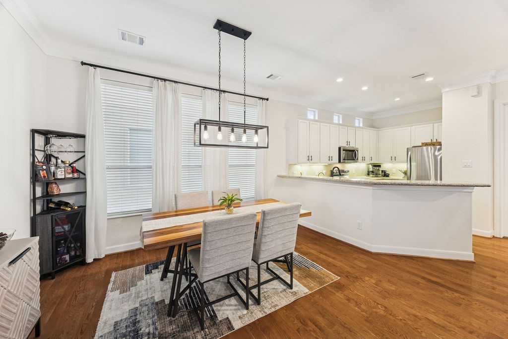 5737 Kansas Street Houston, TX 77007 - Photo 18 of 47 a view of a dining room with furniture