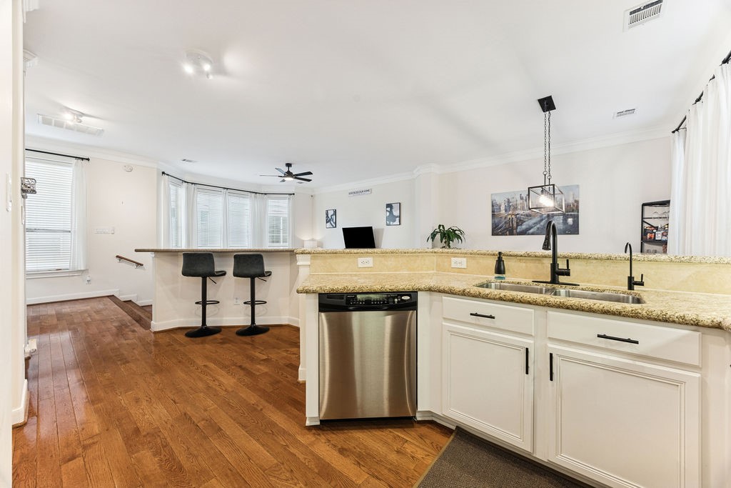 5737 Kansas Street Houston, TX 77007 - Photo 20 of 47 a kitchen with a sink cabinets and wooden floor