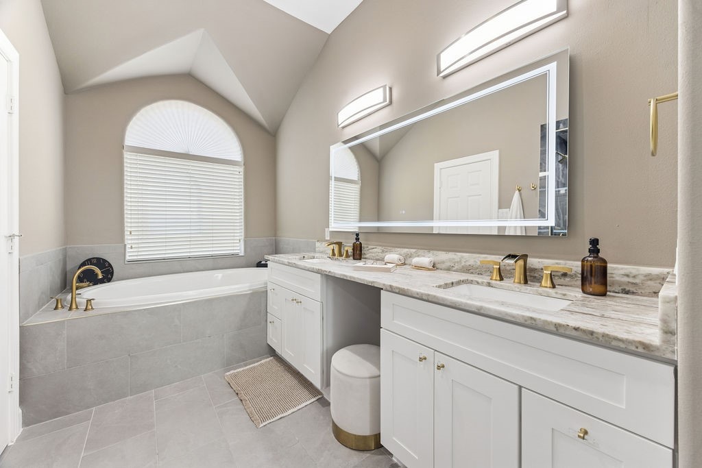 5737 Kansas Street Houston, TX 77007 - Photo 31 of 47 a bathroom with a granite countertop sink mirror and a