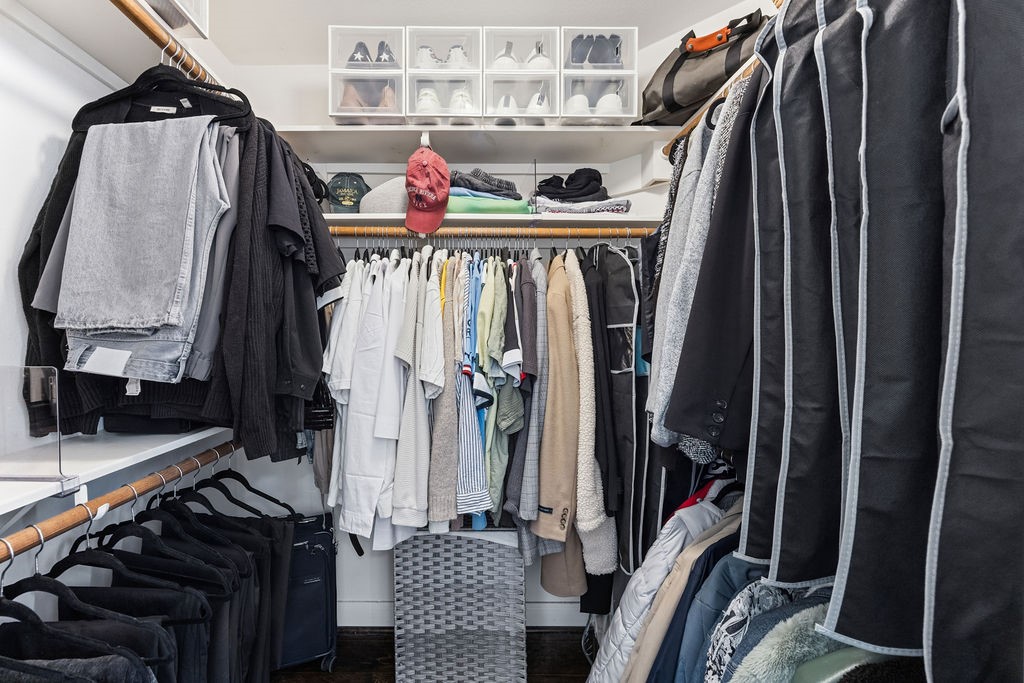 5737 Kansas Street Houston, TX 77007 - Photo 35 of 47 a view of walk in closet with clothes and shoes