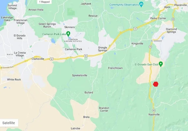 a view of a yard covered with snow in front of house