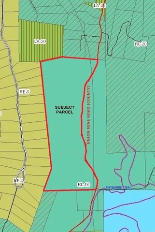 a view of a yard covered with snow in front of house