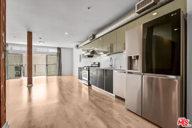 a view of a kitchen with wooden floor