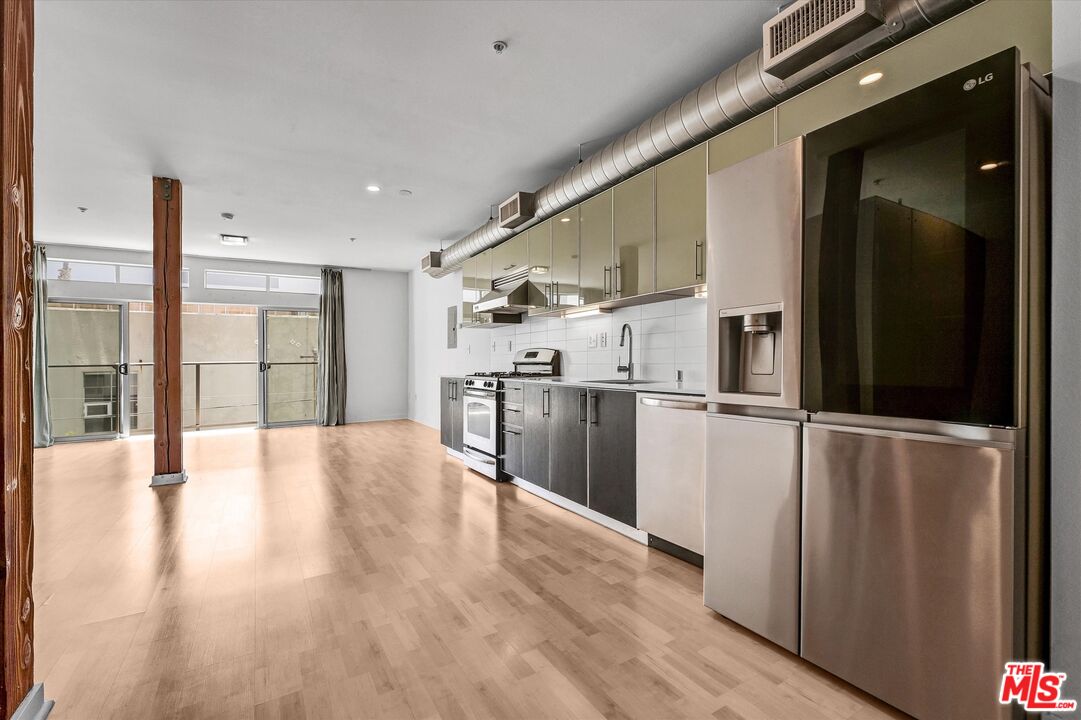 4215 Glencoe Avenue, Unit 207 Marina del Rey, CA 90292 - Photo 5 of 16 a view of a kitchen with wooden floor