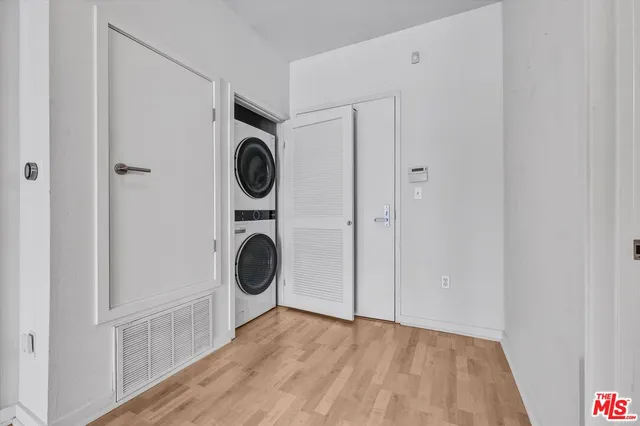 a view of an entryway with wooden floor