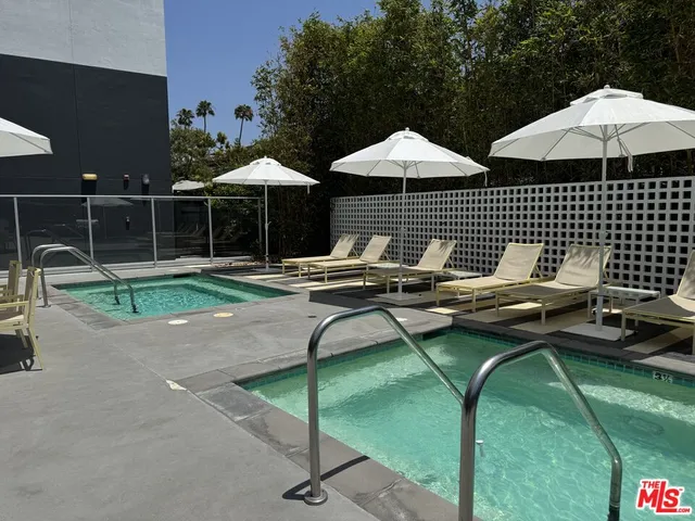 a patio with patio table and chairs