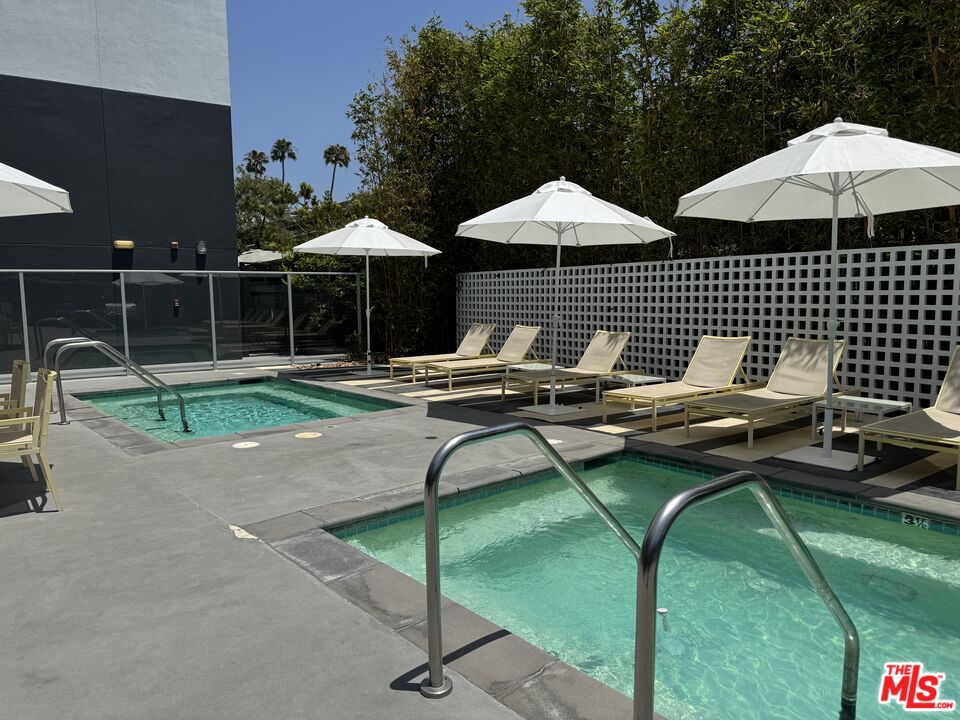 4215 Glencoe Avenue, Unit 207 Marina del Rey, CA 90292 - Photo 8 of 16 a patio with patio table and chairs