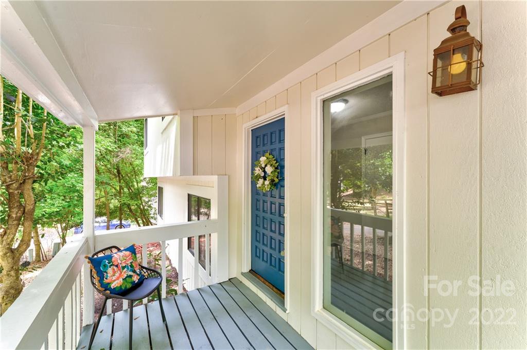 3088 Point Clear Drive Tega Cay, SC 29708 - Photo 1 of 32 a balcony with wooden floor and outdoor space