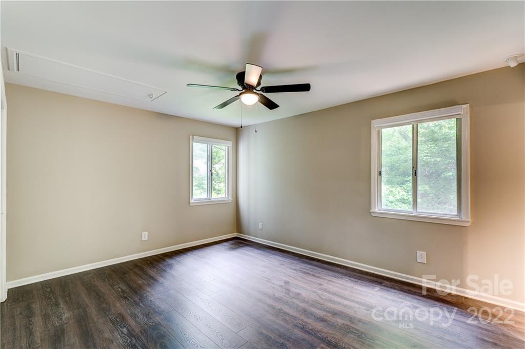 3088 Point Clear Drive Tega Cay, SC 29708 - Photo 14 of 32 a view of empty room with wooden floor and fan