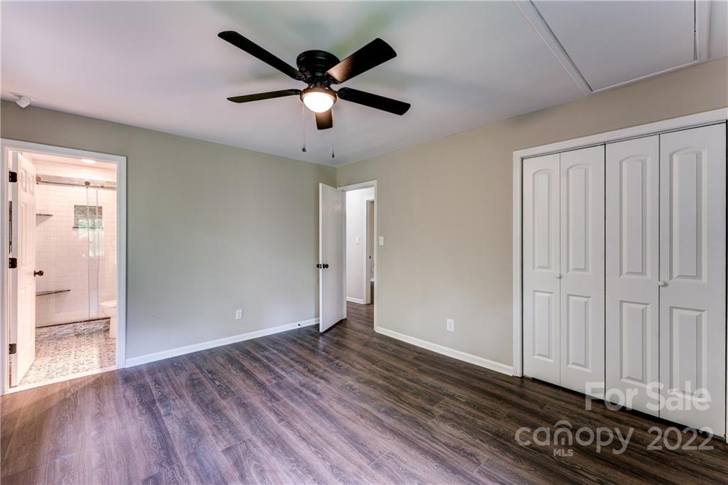 3088 Point Clear Drive Tega Cay, SC 29708 - Photo 15 of 32 an empty room with wooden floor closet and windows