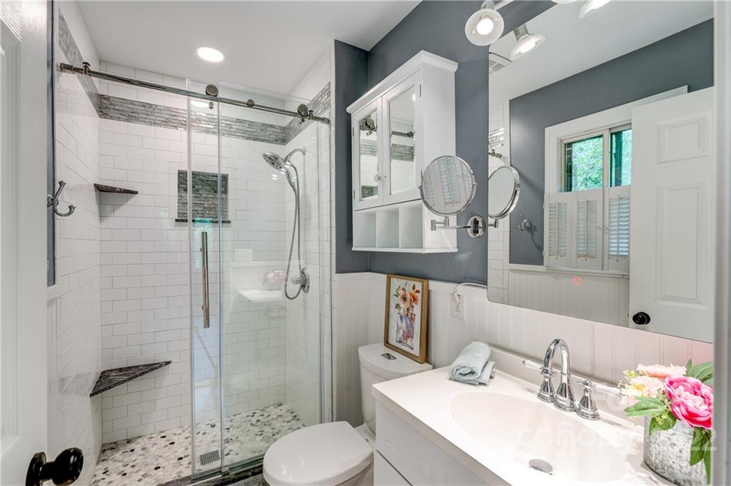 3088 Point Clear Drive Tega Cay, SC 29708 - Photo 16 of 32 a bathroom with a sink vanity granite toilet and shower