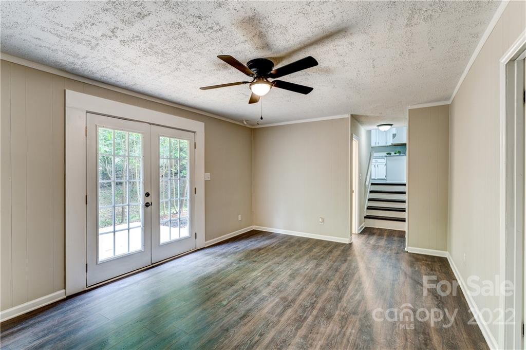 3088 Point Clear Drive Tega Cay, SC 29708 - Photo 18 of 32 a view of empty room with wooden floor and fan