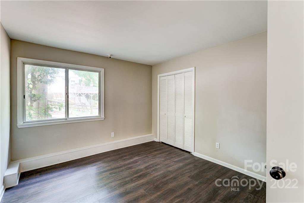3088 Point Clear Drive Tega Cay, SC 29708 - Photo 20 of 32 an empty room with wooden floor and windows