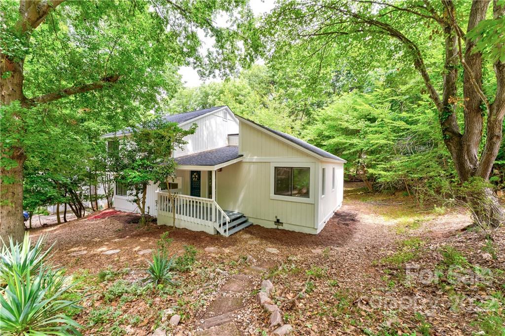 3088 Point Clear Drive Tega Cay, SC 29708 - Photo 2 of 32 a view of a house with a yard and large tree