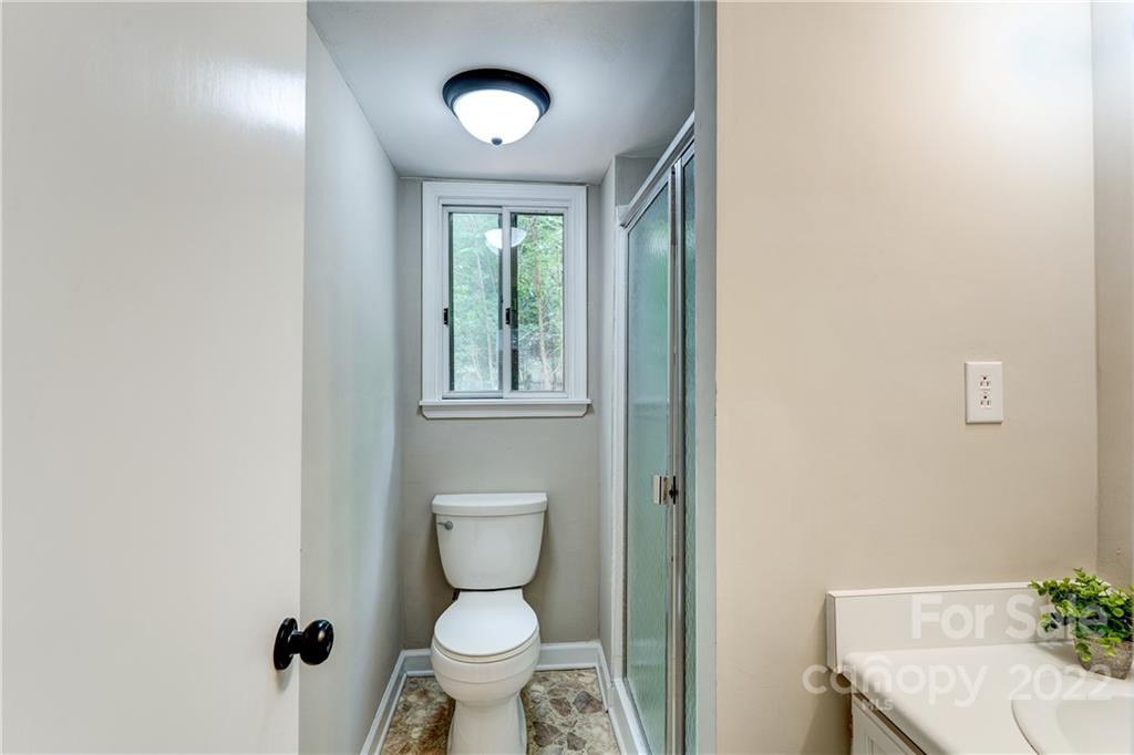 3088 Point Clear Drive Tega Cay, SC 29708 - Photo 21 of 32 a bathroom with a granite countertop toilet and a sink