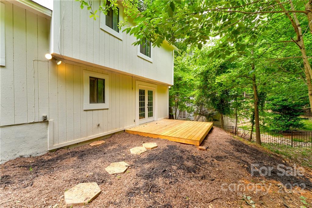 3088 Point Clear Drive Tega Cay, SC 29708 - Photo 23 of 32 a view of a backyard with a barn and a yard