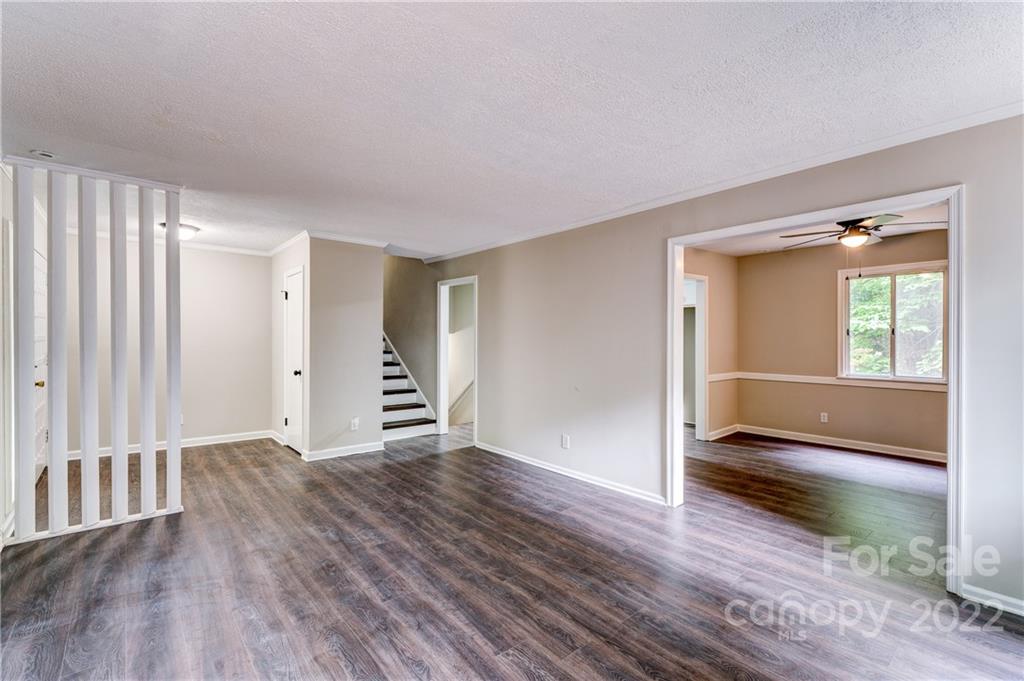3088 Point Clear Drive Tega Cay, SC 29708 - Photo 6 of 32 a view of an empty room with wooden floor and a window