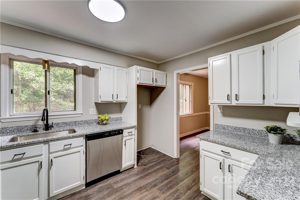3088 Point Clear Drive Tega Cay, SC 29708 - Photo 10 of 32 a kitchen with granite countertop cabinets stainless steel appliances a sink and a window