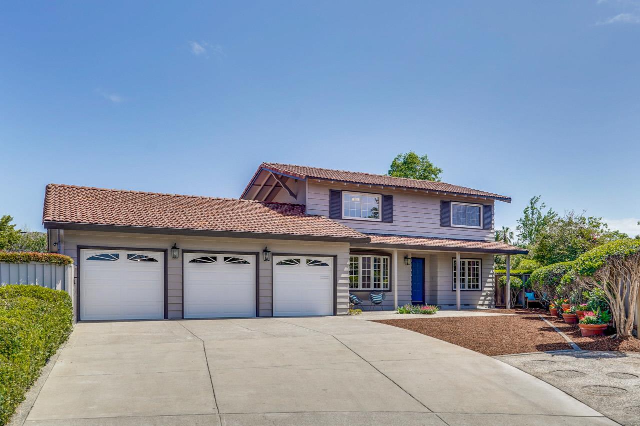 a front view of a house with yard