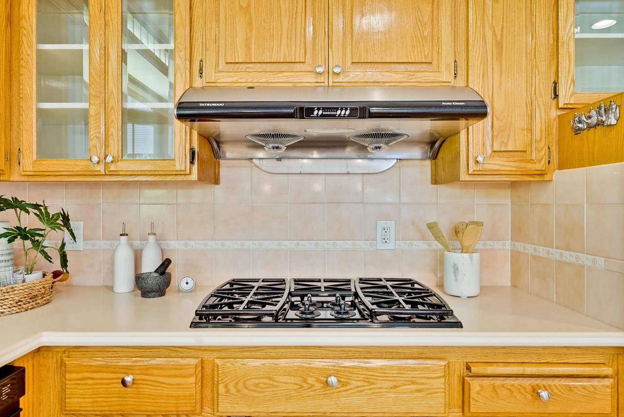 592 Torland Court Sunnyvale, CA 94087 - Photo 16 of 51 a stove top oven sitting inside of a kitchen