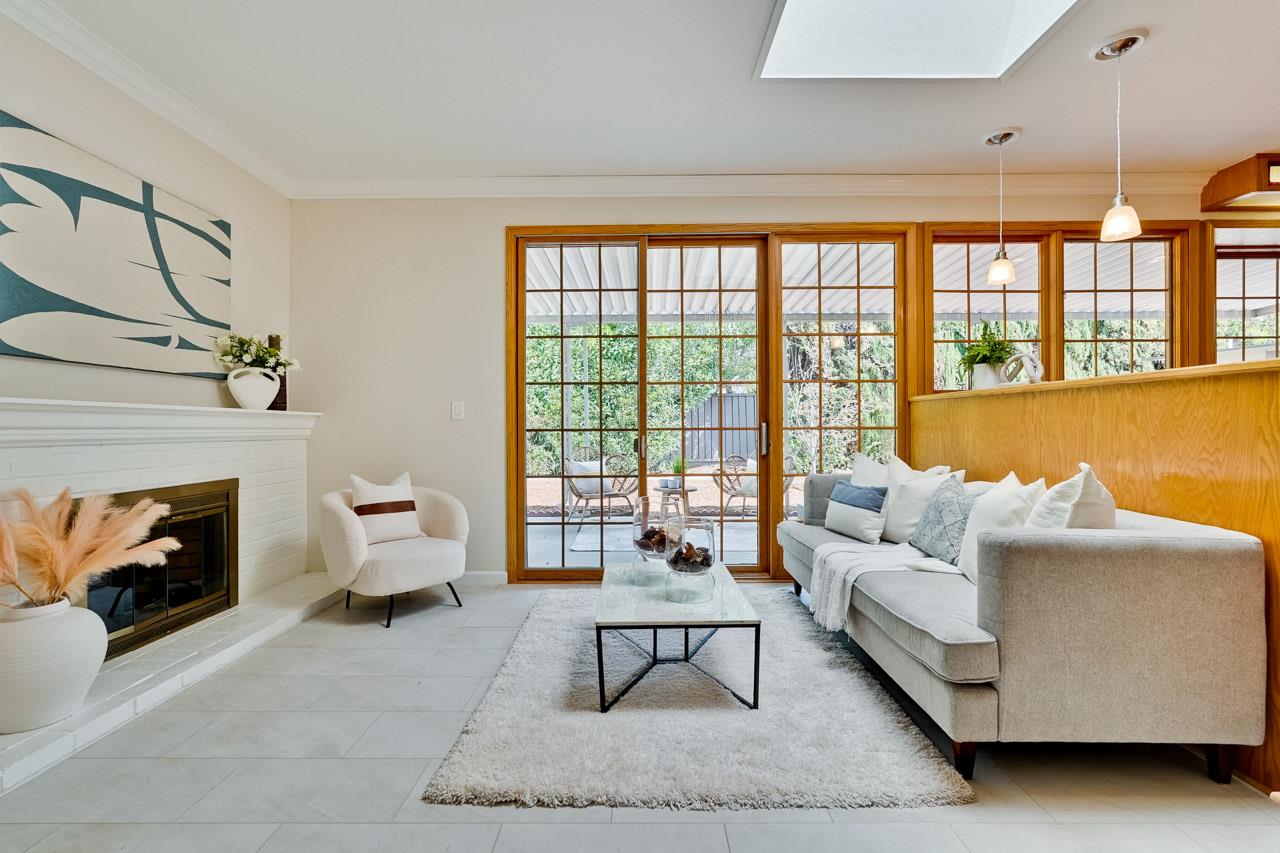 592 Torland Court Sunnyvale, CA 94087 - Photo 17 of 51 a living room with furniture and a fireplace