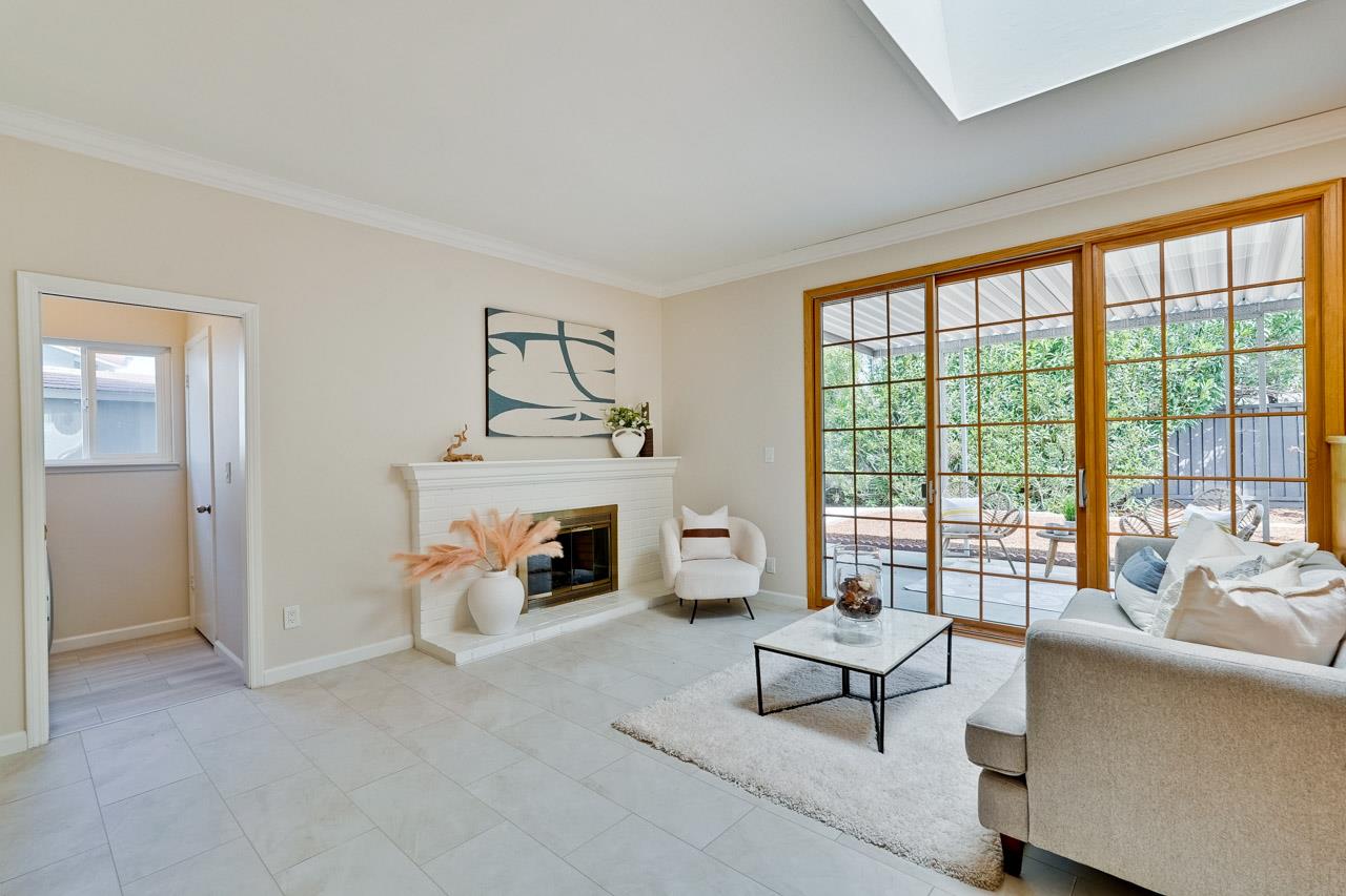 592 Torland Court Sunnyvale, CA 94087 - Photo 19 of 51 a living room with furniture and a fireplace