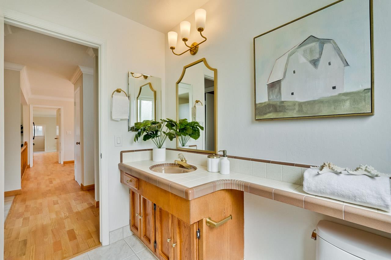 592 Torland Court Sunnyvale, CA 94087 - Photo 24 of 51 a bathroom with a sink and a mirror