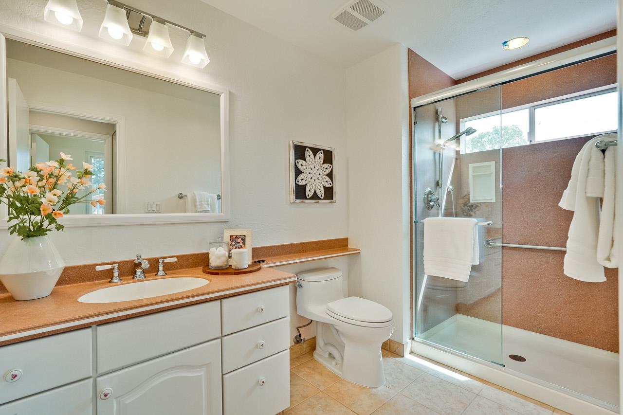 592 Torland Court Sunnyvale, CA 94087 - Photo 37 of 51 a bathroom with a granite countertop sink a toilet and shower