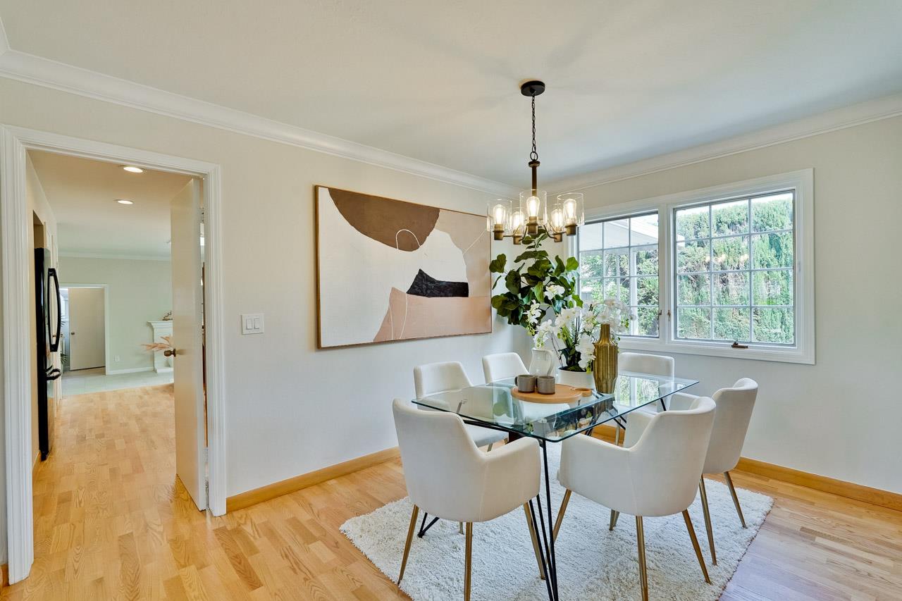 592 Torland Court Sunnyvale, CA 94087 - Photo 8 of 51 a dining room with furniture potted plants and wooden floor
