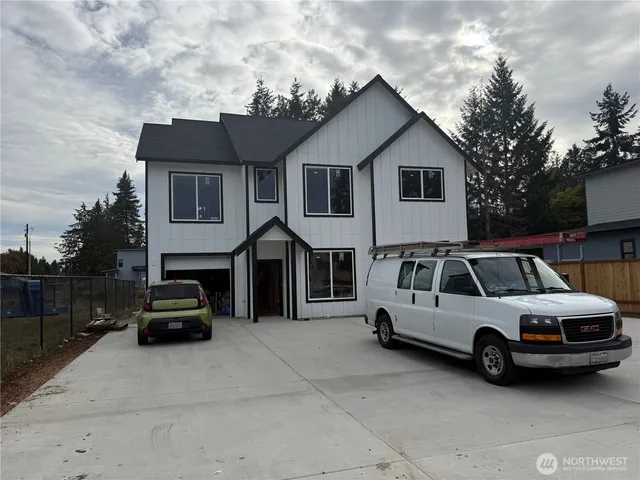 a view of a car parked in front of a house