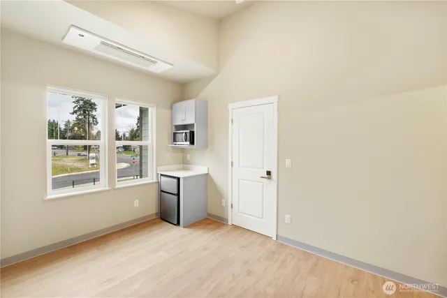 a view of an empty room with a window