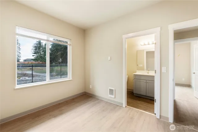 a view of a bathroom with a sink and a mirror