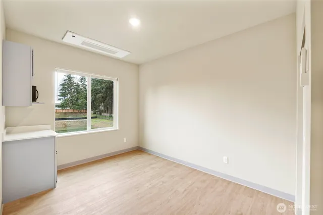 a view of an empty room with a window